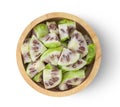 Noni fruit slice in wood bowl on white