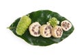 Noni fruits on branch green leaves isolated on white background.topview,flat lay Royalty Free Stock Photo