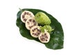 Noni fruits on branch green leaves isolated on white background.topview,flat lay Royalty Free Stock Photo