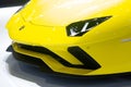 Nonthaburi , Thailand - Dec 6, 2018: Lamborghini Aventador yellow super sports cars in motor expo . close up headlights and
