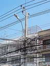 Disarrangement of Electric Wire on Pole near Building