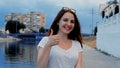 Nonverbal communication NVC . Beautiful young woman showing russian all-is-good sign with fingers a nd smiling