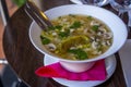 Noodle Bowl With vegetables and dumplings. Close up of a bowl Chinese style on wooden background Royalty Free Stock Photo