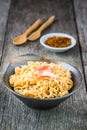 Noodle in ceramic bowl with crab stick on wooden background. Royalty Free Stock Photo