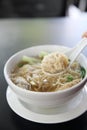 Noodle and wonton soup on a bowl Royalty Free Stock Photo