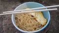 noodle with egg in the bowl with a chopstick