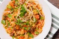 Noodle  meat, sauce and herbs in a plate on a towel on a dark wooden ,  Asian cuisine Royalty Free Stock Photo