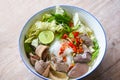 Noodle soup bowl pork blood pudding and pork offal, Thai rice vermicelli noodle with clear soup and fresh vegetable set with lemon Royalty Free Stock Photo