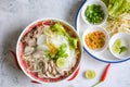 Noodle soup bowl, Thai rice vermicelli noodle with spicy soup and fresh vegetable set with lemon sprouts bean pepper chili sauce Royalty Free Stock Photo