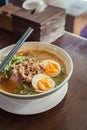 Noodle Tom Yam, hot spicy soup served with boiled egg. Royalty Free Stock Photo