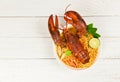 Noodles bowl lobster spicy soup / Cooked seafood with instant noodles soup lobster dinner table and spices ingredients on table Royalty Free Stock Photo