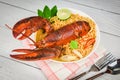 Noodles bowl lobster spicy soup / Cooked seafood with instant noodles soup lobster dinner table and spices ingredients on table Royalty Free Stock Photo