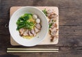 Noodles bowl on wooden background