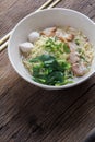 Noodles bowl on wooden background