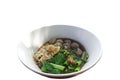 Noodles with meatballs in a white bowl. White background It`s a boat noodle recipe