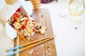 Noodles with mushroom and vegetables in take-out box on wooden table Royalty Free Stock Photo
