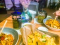 Noodles, nachos and tortilla chips on a table in a restaurant Royalty Free Stock Photo