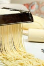 Noodles and pasta machine. Royalty Free Stock Photo