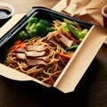 Noodles with pork and vegetables in take-out box on wooden table Royalty Free Stock Photo