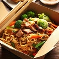 Noodles with pork and vegetables in take-out box on wooden table Royalty Free Stock Photo