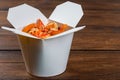 Noodles in a white box on wooden background Royalty Free Stock Photo