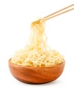 Noodles in a wooden bowl and chopsticks on a white plate. Isolated Royalty Free Stock Photo
