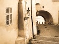 Nooks of Lesser Town in Prague. Old staircase with street lamp and tunnel. Vintage sepia style image. Prague, Czech Royalty Free Stock Photo