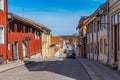 NORA, SWEDEN, APRIL 19, 2019: Timber houses alongside a narrow street at Nora, Sweden