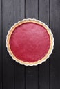 Nordic dessert. Tasty homemade red lingonberry cowberry pie on b