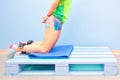 Nordic hamstring exercise on a pallet at the gym Royalty Free Stock Photo