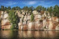 nordic rocky shore, trees on cliffs. Gulf of Finland, Vyborg bay, Monrepos park