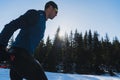 Nordic skiing or Cross-country skiing classic technique practiced by man in a beautiful panoramic trail at morning. Royalty Free Stock Photo