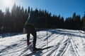 Nordic skiing or Cross-country skiing classic technique practiced by man in a beautiful panoramic trail at morning. Royalty Free Stock Photo