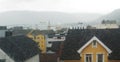 Nordic town Tromso through the wet window glass. Royalty Free Stock Photo