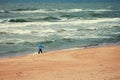 Nordic walker on the beach Royalty Free Stock Photo