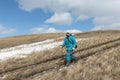 Nordic Walking - adult woman descending from the mountain