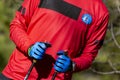 Nordic walking. Close-up of some hands with walking sticks in an outdoor park in Madrid, Spain.