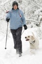 Nordic walking with dog Royalty Free Stock Photo