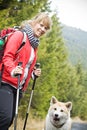 Nordic Walking with dog in mountains Royalty Free Stock Photo