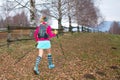 Nordic walking Girl in autumn path