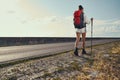 Nordic walking trip of woman next to motorway