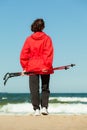 Nordic walking. Woman hiking on the beach. Royalty Free Stock Photo