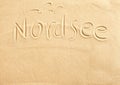 Nordsee and seagulls drawn in beach sand