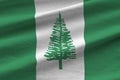 Norfolk island flag with big folds waving close up under the studio light indoors. The official symbols and colors in banner