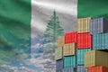 Norfolk island flag and big stack of shipping cargo containers in docks with sky background Royalty Free Stock Photo