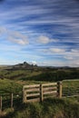 Norhtland New Zealand. Pature land with fence and gate view with blue skies and Cirrus clouds