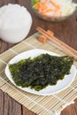 Nori sheet dried seaweed, Crispy seaweed on plate with rice.