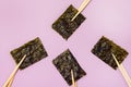 Nori Sheets with Sticks for Sushi Pink Background Horizontal Japanese Snack Top View Royalty Free Stock Photo