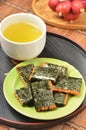 Norimaki senbei and green tea Royalty Free Stock Photo