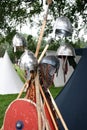 Norman helmets and shields at the reenactment of The Battle of Hastings in England Royalty Free Stock Photo